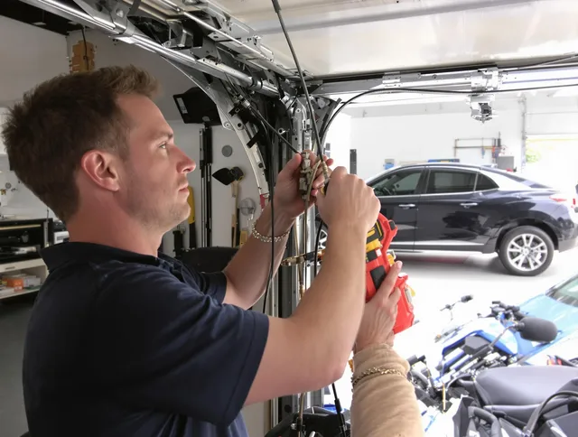 Newport Beach Garage Door Repair safety certified technician performing cable replacement in Newport Beach