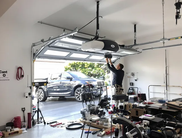 Newport Beach Garage Door Repair specialist installing smart garage door opener system in Newport Beach home